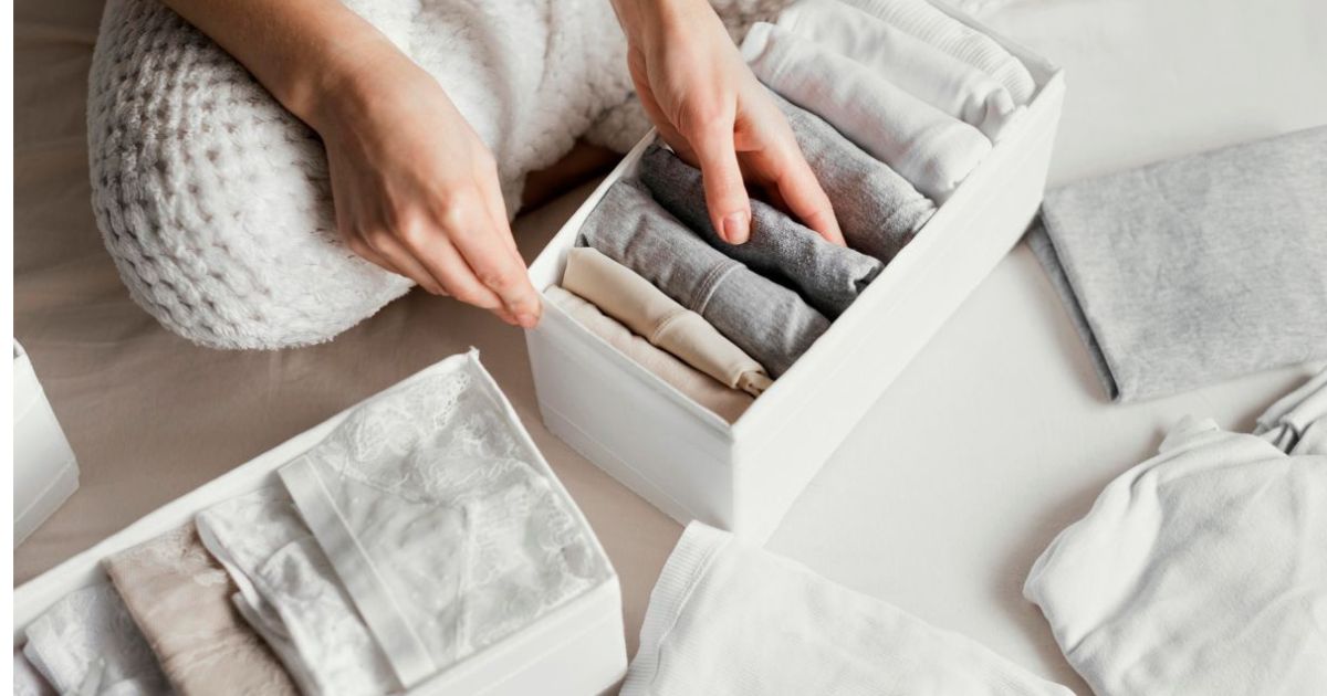 "Capsule wardrobe on wooden hangers with neutral colors beige white black, quality natural fibers linen cotton and wool, minimalist closet organization small collection"