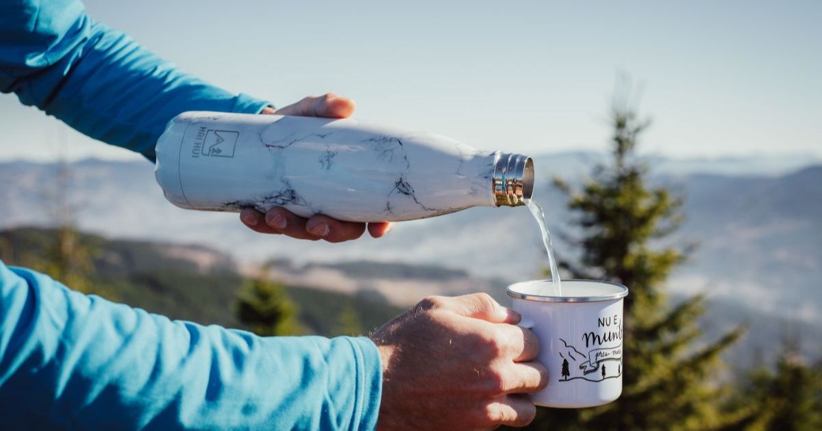 Refill app on smartphone showing nearby water refill stations, person filling reusable bottle, plastic-free living app