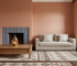 Moroccan-inspired living room with terracotta plaster walls, patterned rug, carved wood and blue zellige tiles